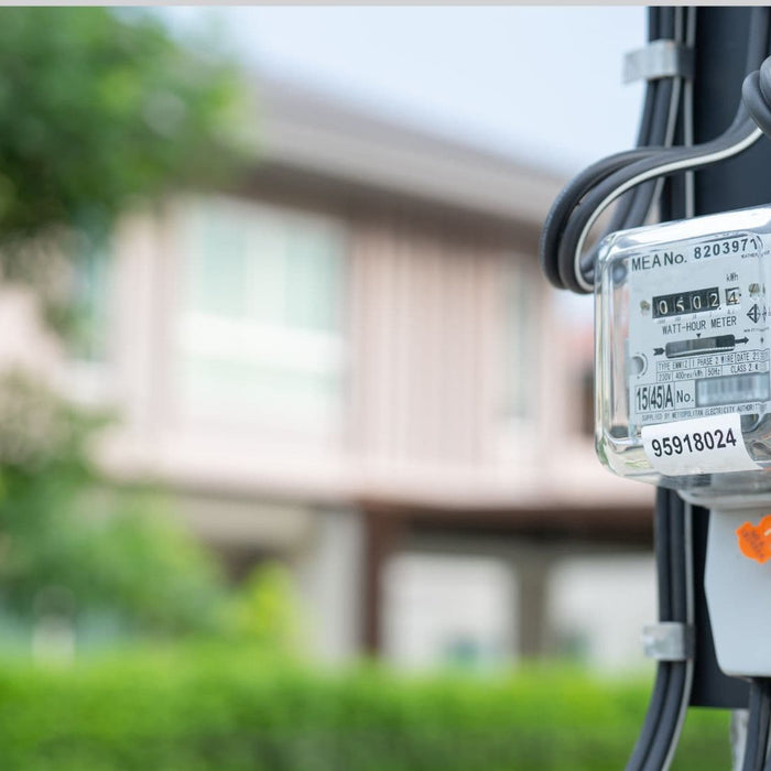 An electricity meter on a pole tracking household electricity usage